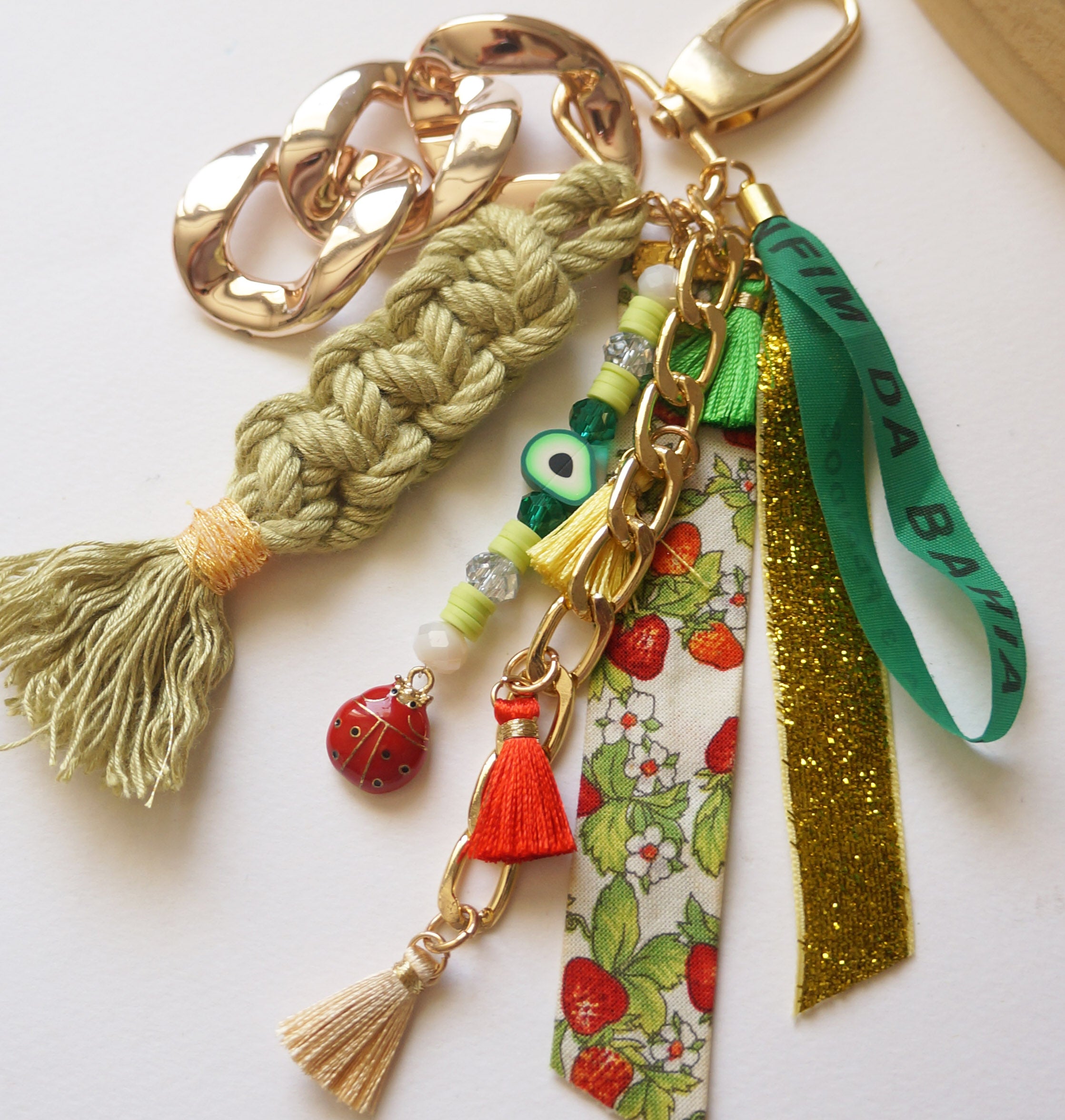 Green Boho Bag Charm – Lucky Bonfim Ribbon Keychain with Evil Eye Beads, Tassels & Ladybug Accent